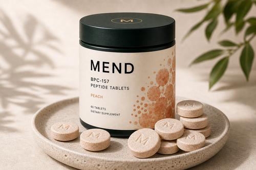 MEND Daily Gut Support Chews Peach jar on a warm stone tray